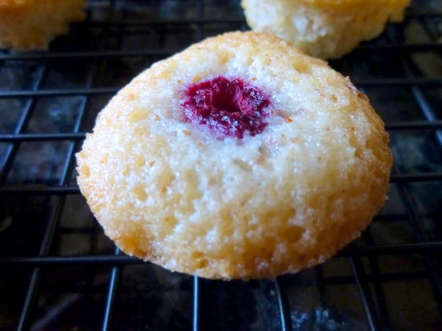 These mini brown butter, coconut and raspberry cakes are called financiers in French. They're buttery and decadent, and perfect bite-sized treats.
