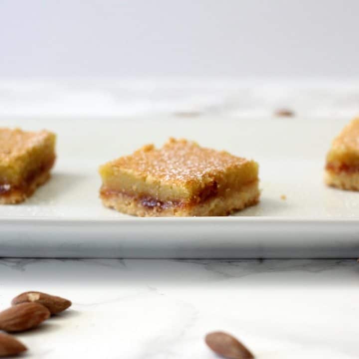 If you're into the flavor of marzipan, then you'll like these layered almond shortbread bars. #raspberry #almond #shortbread #barcookies