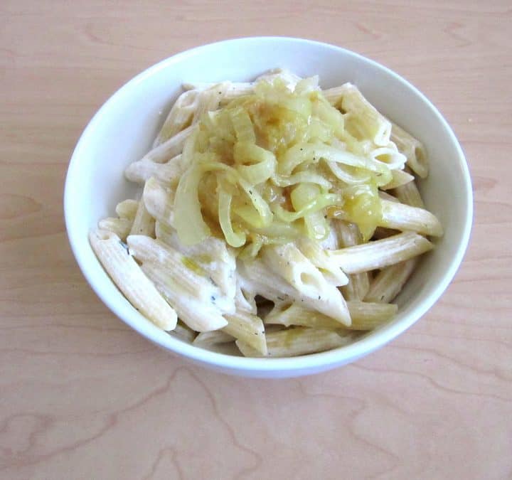Greek yogurt pasta: pasta tossed in an easy, creamy yogurt sauce and topped with caramelized onions and plenty of parmesan cheese.