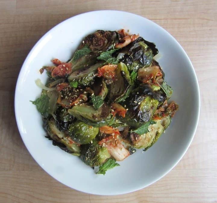 These roasted brussels sprouts with kimchi and ginger are the perfect side if you have an otherwise plain meal. #brusselssprouts #kimchi #ginger