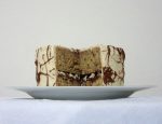 This banana cake with banana Nutella swirl buttercream also has a surprise layer of chocolate-covered almonds on the inside. #banana #nutella #cake #almonds