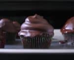 The chocolate glaze shines gloriously on these chocolate hi hat cupcakes with peanut butter buttercream. #peanutbutter #chocolate #cupcakes #buttercream