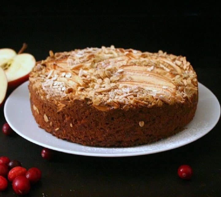 This apple cake with almond crumb topping is the perfect fall dessert when all you want are apples and cranberries. #cranberry #fallbaking #cakes #almond