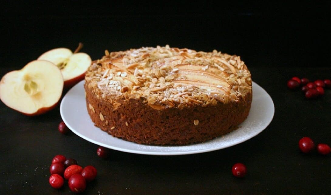This apple cake with almond crumb topping is the perfect fall dessert when all you want are apples and cranberries. #cranberry #fallbaking #cakes #almond