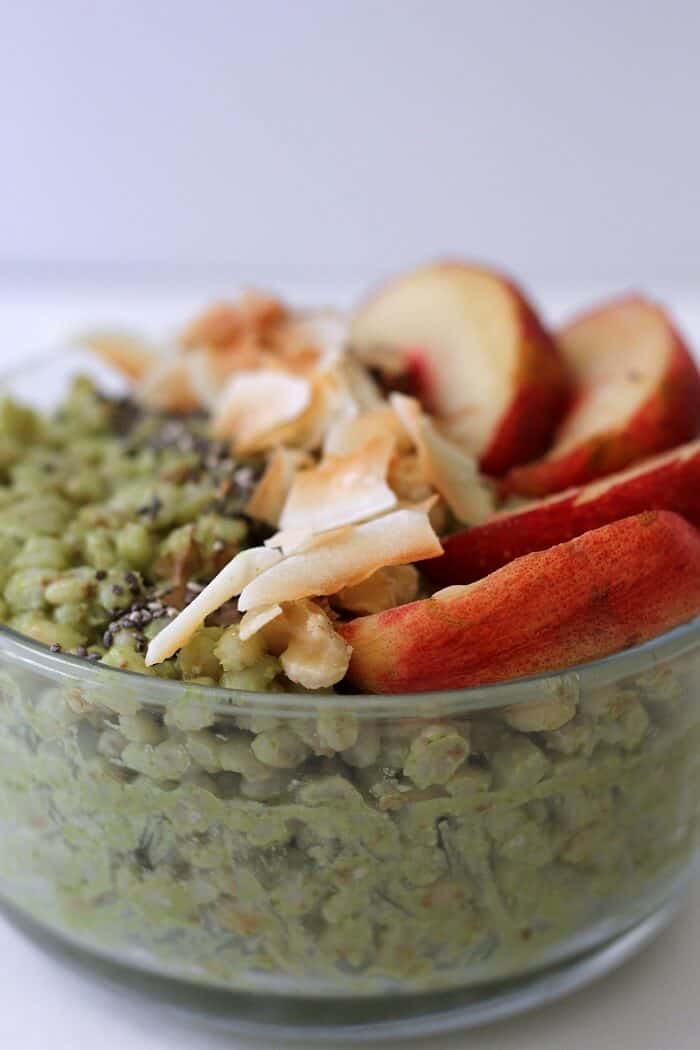 The more toppings on this matcha coconut breakfast bowl, the better! There's nectarines, toasted coconut, walnuts and chia seeds on this one. #matcha #coconut #breakfast #vegan #barley