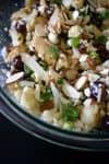 A smattering of scallions on top provides a bit more color amongst the cream-colored cauliflower and deep dark pickled grapes. #cauliflower #grapes #cheddar #almonds #vegetarian