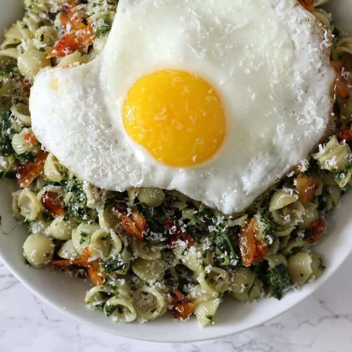 This creamed kale and kimchi pasta features a creamy kale and coconut milk sauce with plenty of crunchy, funky kimchi. #kale #kimchi #pasta #entree