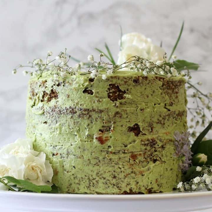 This jasmine green tea cake with raspberry jam pairs floral jasmine-scented cake with plenty of bright (in flavor and color!) matcha buttercream. #jasminetea #matcha #cake #raspberryjam
