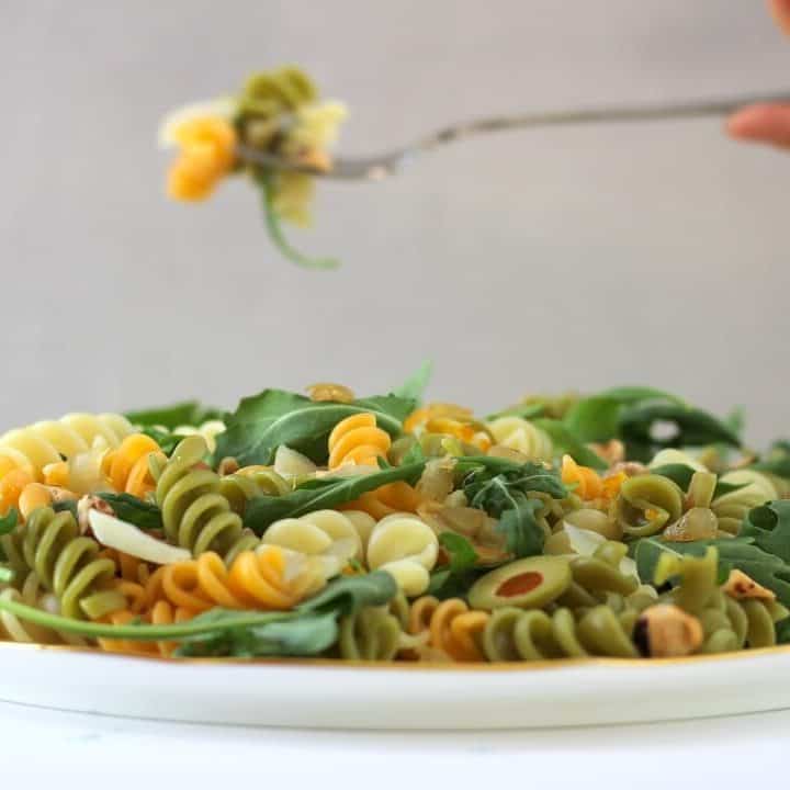 This olive pasta with kumquat vinaigrette is the kind of addictive that has you eating a bite straight from the serving dish. #olives #pasta #pastasalad #arugula #preservedlemon