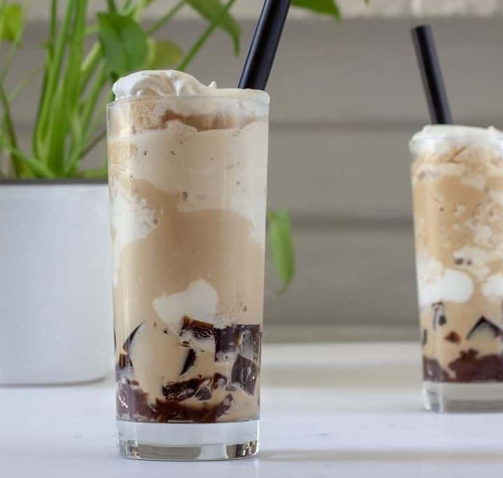 This frozen coffee is layered with plenty of almond scented whipped cream, coffee jelly and sweet red bean! #coffee #frozencoffee #dessert #drinks #whippedcream