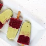 These matcha popsicles with cherry rose compote are a pretty two-tone frozen treat that's more creamsicle than popsicle. #matcha #greentea #popsicles #cherry