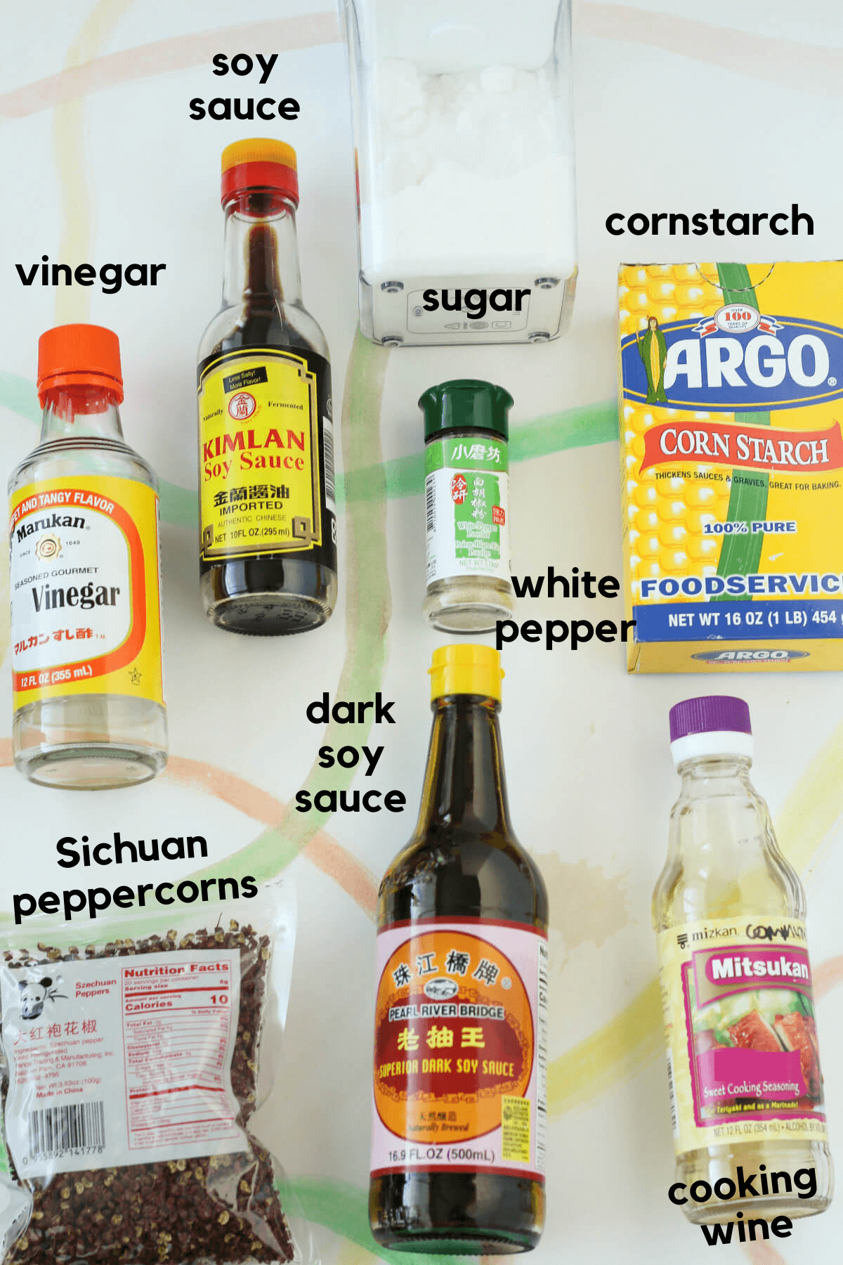 The rest of the ingredients for the kung pao paneer sauce, including vinegar, soy sauce, sugar, white pepper, cornstarch, cooking wine, dark soy sauce and Sichuan peppercorns.